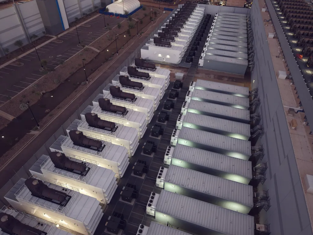 Rows of backup generators beside a data center